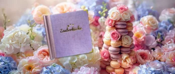 Menue-Buch der Zauberküche, gebette auf einem Blumenbouquet
